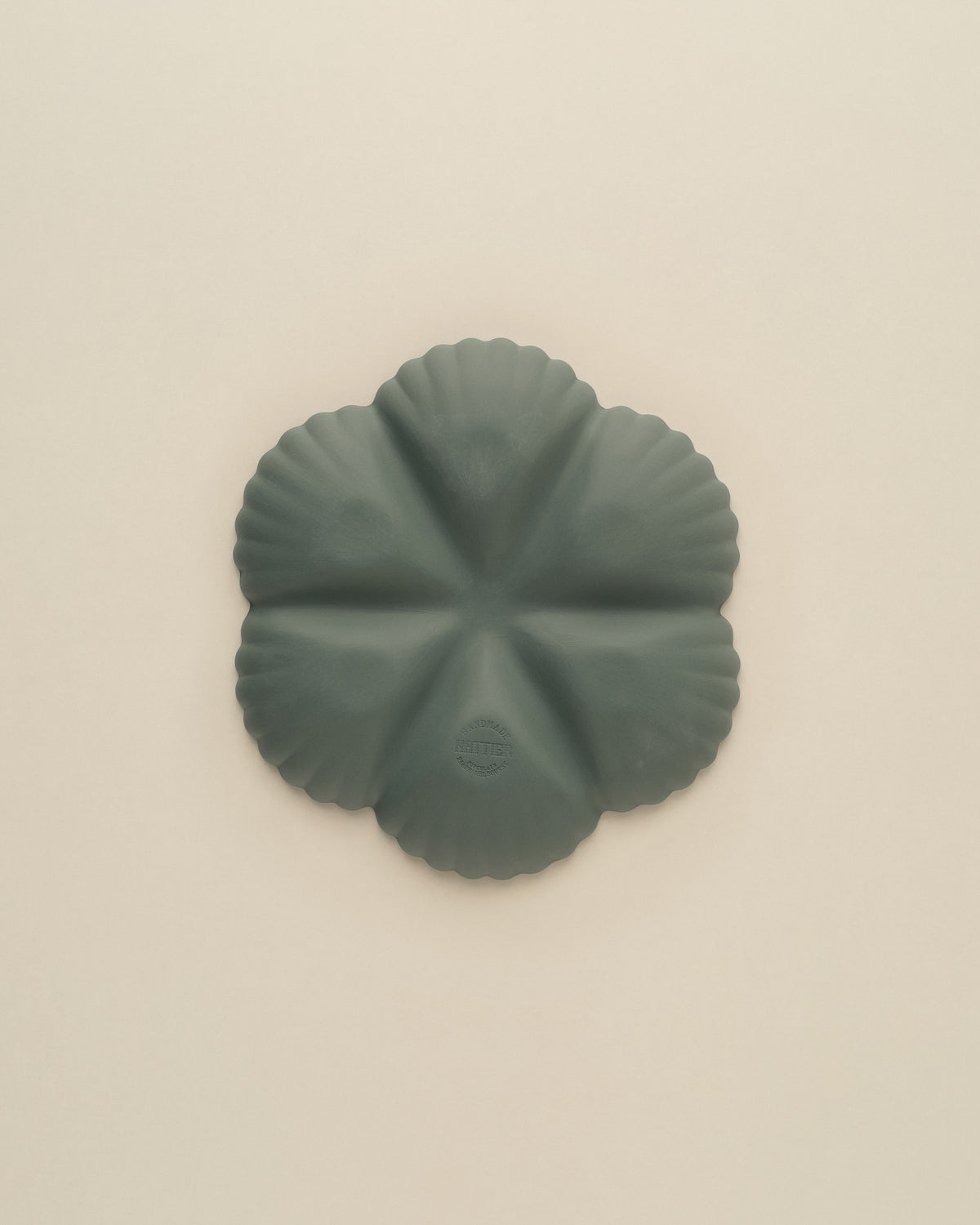 Underside of the Dark Forest Green Half Dozen oyster plate, matte unglazed porcelain