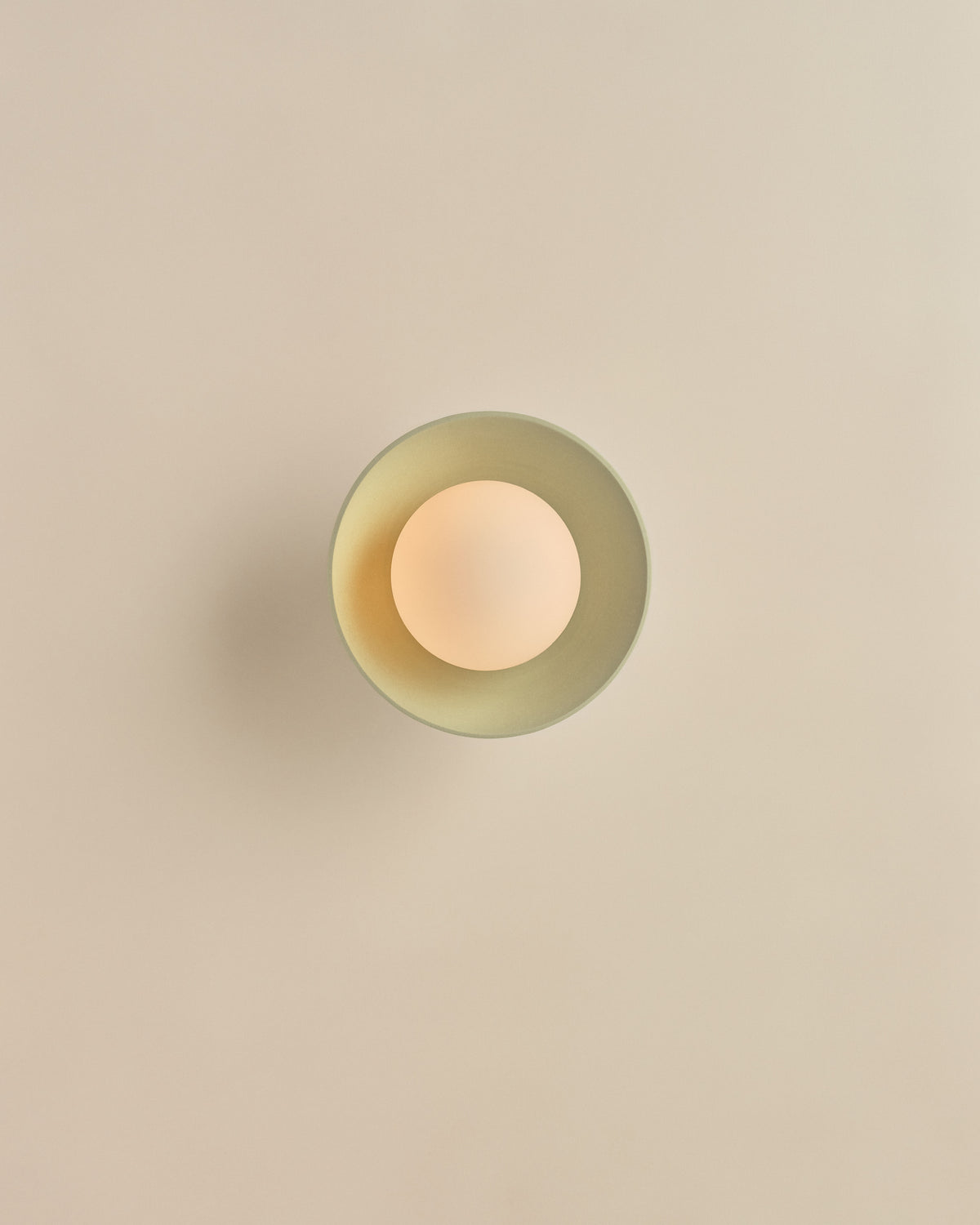 Pixie Wall Sconce in Eucalypt Green, lit