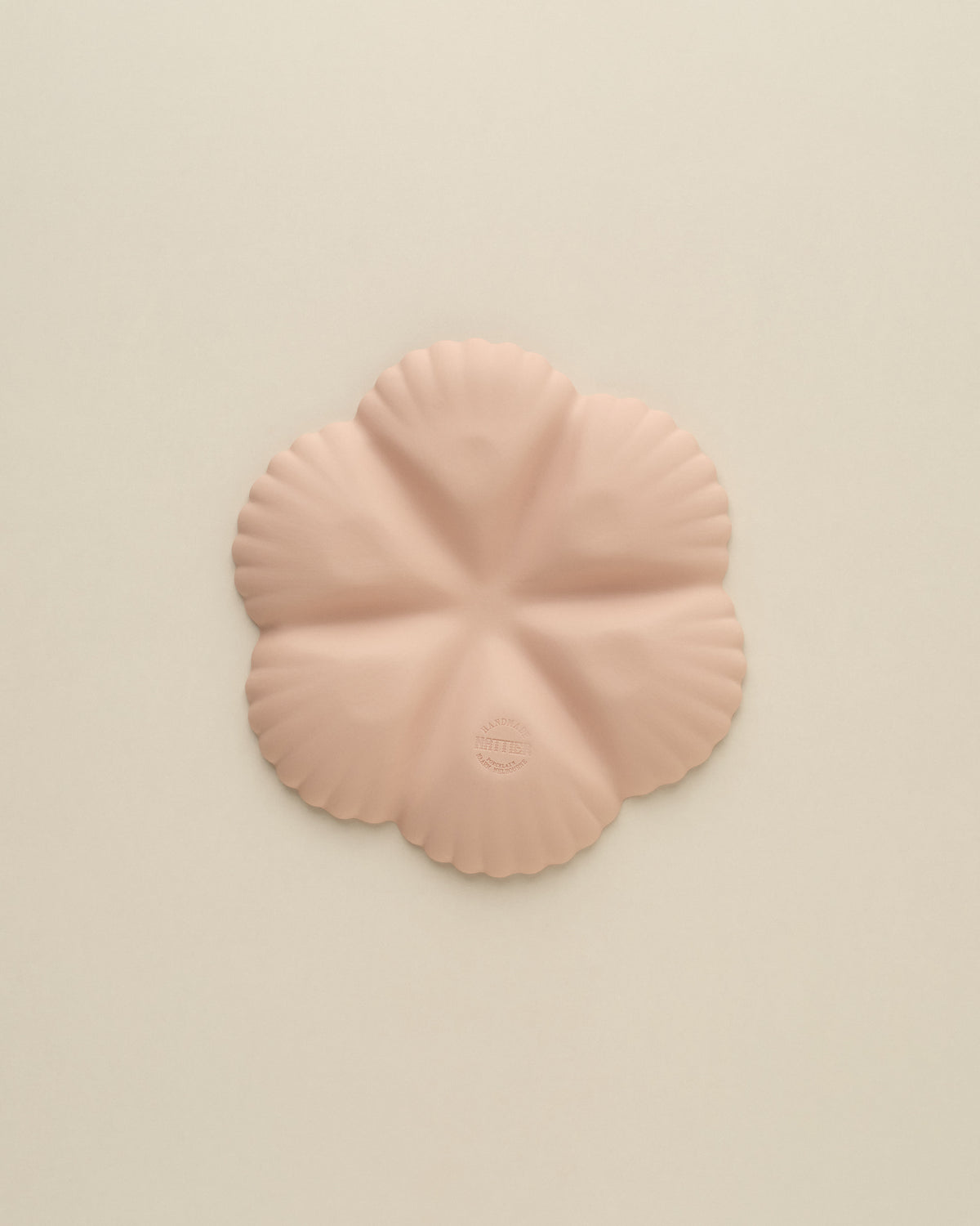 Underside of the Whispery Pink Half Dozen oyster plate, matte unglazed porcelain