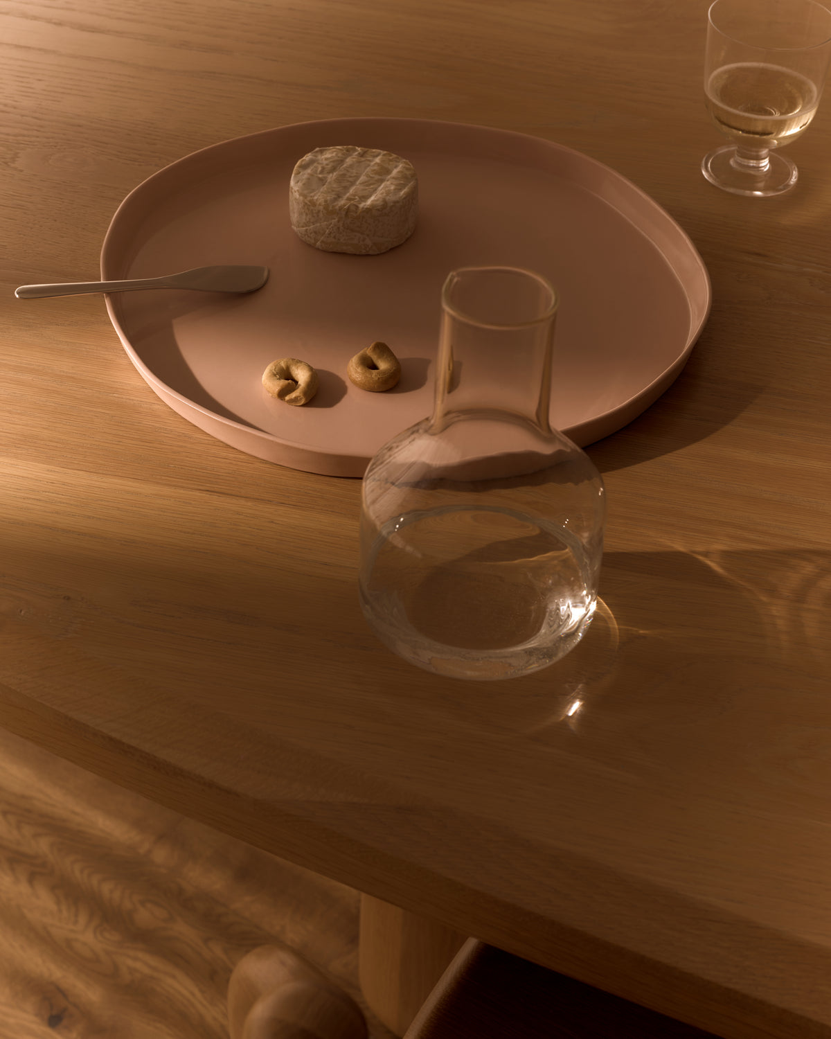 Ribbons Platter in Whispery Pink, styled on a table with glassware