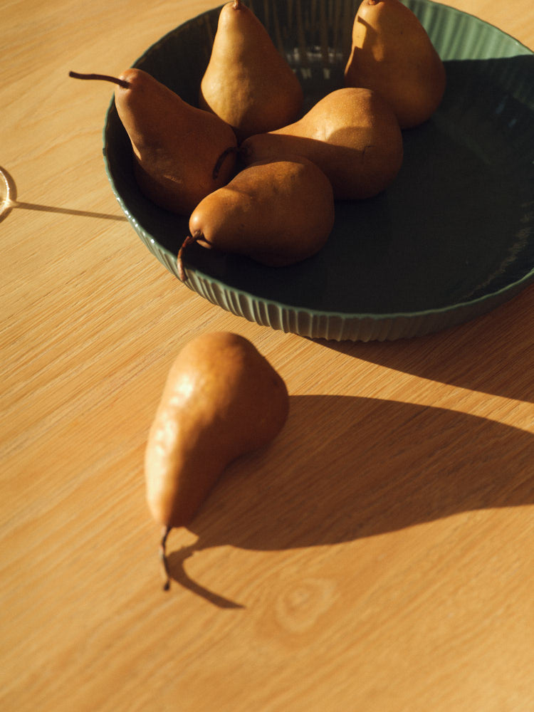 Dark Forest Green Banksia Bowl with pears. Photograph by Sarah Forgie