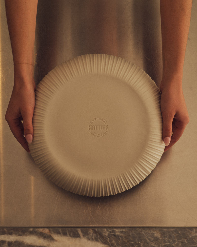 Natural White Banksia Bowl held in two hands. Photograph by Sarah Forgie