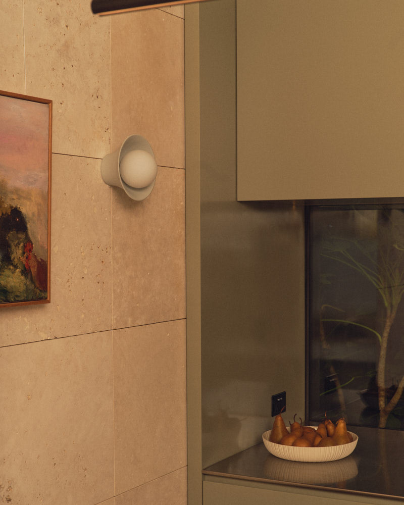 Light Blue Grey Pixie Wall Sconce beside a painting. Photograph by Sarah Forgie