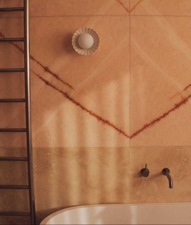 Natural White Daisy Wall Sconce above a bath. Photograph by Sarah Forgie