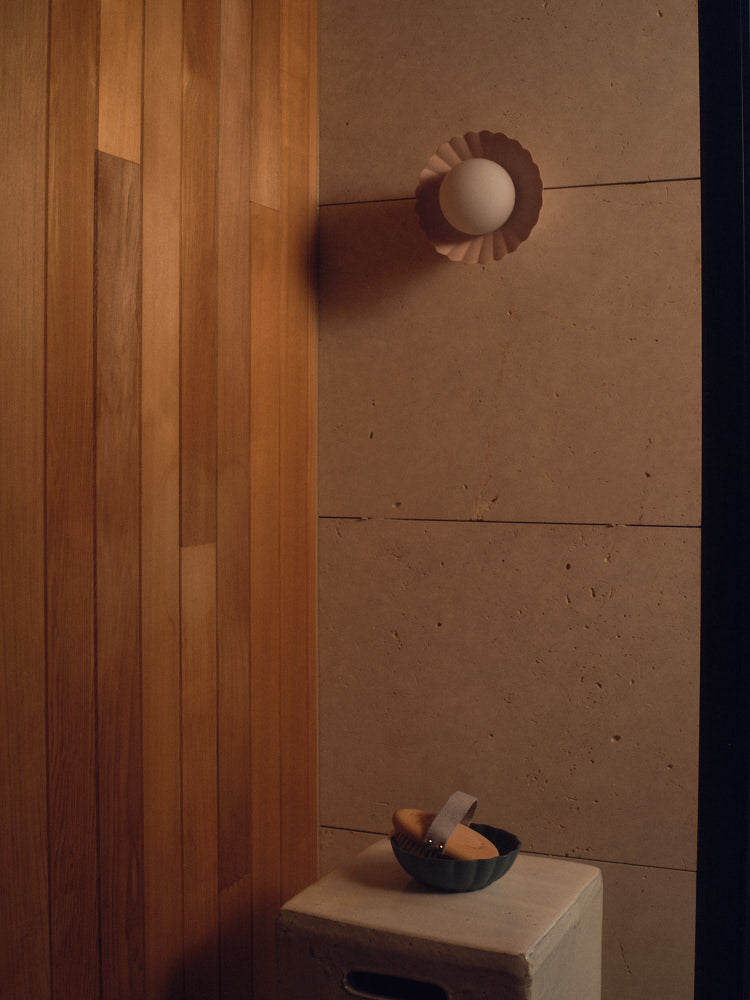 Whispery Pink Daisy Wall Sconce in an interior. Photograph by Sarah Forgie