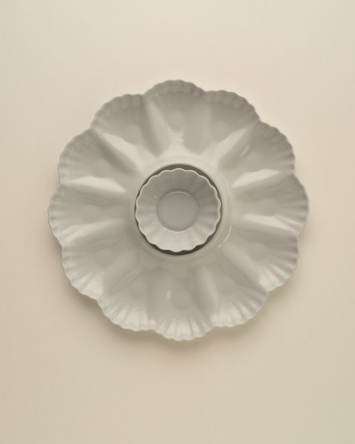Mother of Pearl Oyster Plate, Dozen, in Light Blue Grey with the XS Fern Nesting Bowl sitting in the centre