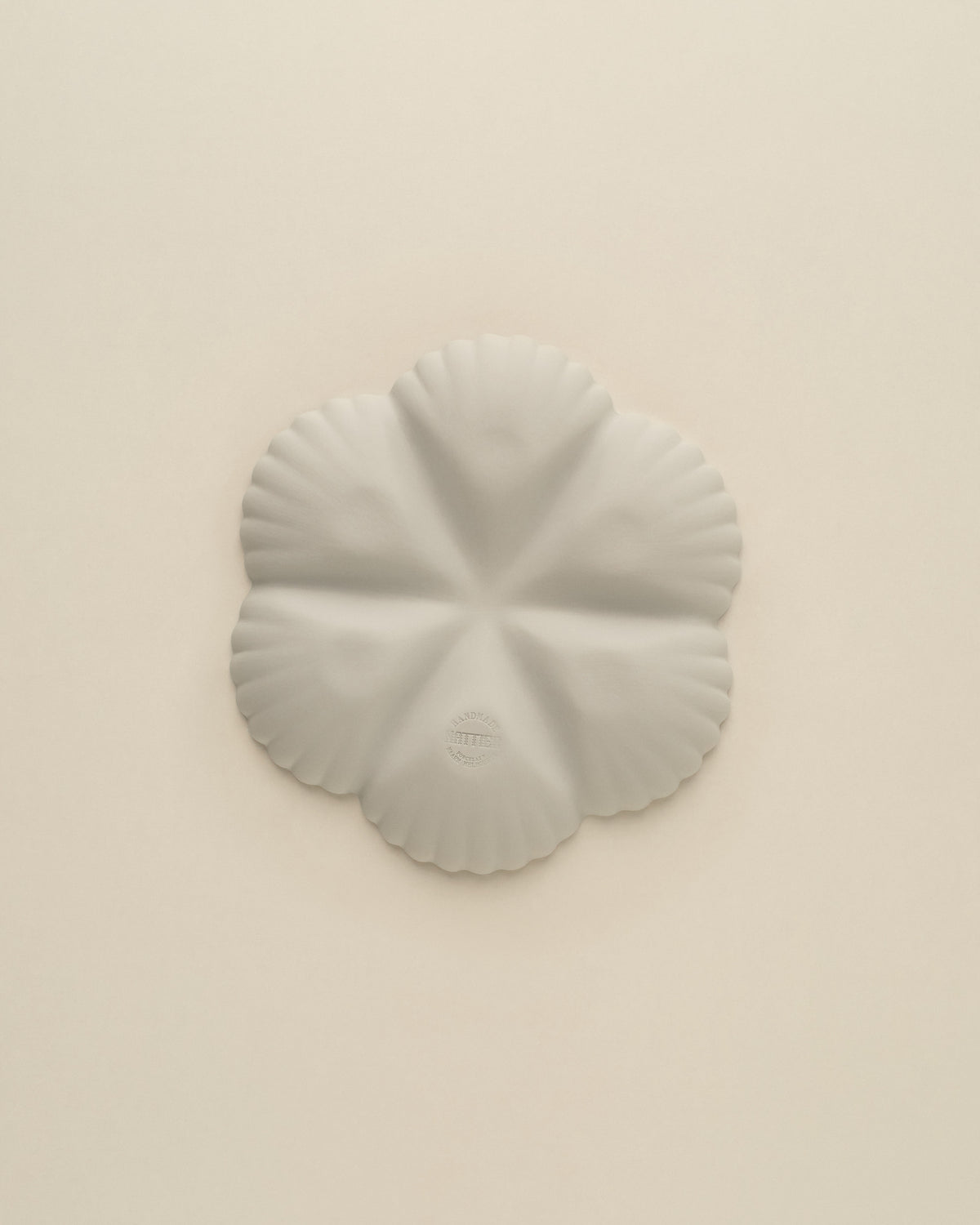 Underside of the Light Blue Grey Half Dozen oyster plate, matte unglazed porcelain