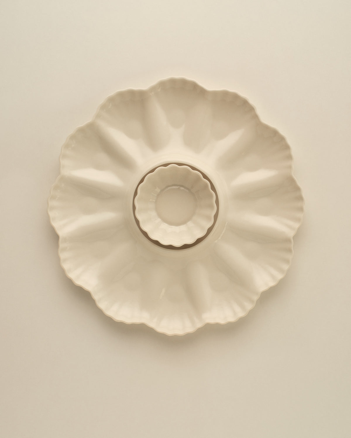 Mother of Pearl Oyster Plate, Dozen, in Natural White with the XS Fern Nesting Bowl sitting in the centre