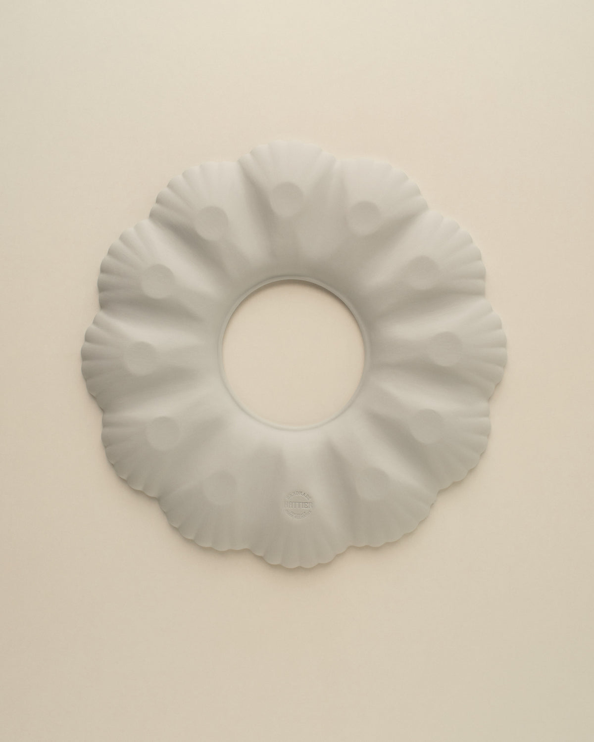 Underside of the Light Blue Grey oyster plate, matte unglazed porcelain with the Nattier maker's mark