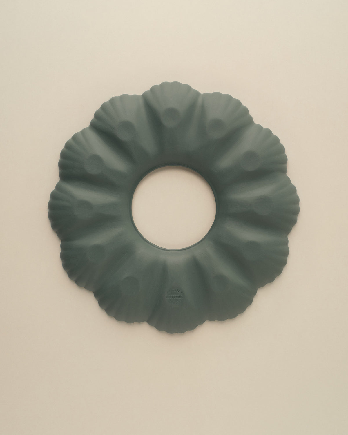 Underside of the Dark Forest Green oyster plate, matte unglazed porcelain with the Nattier maker's mark